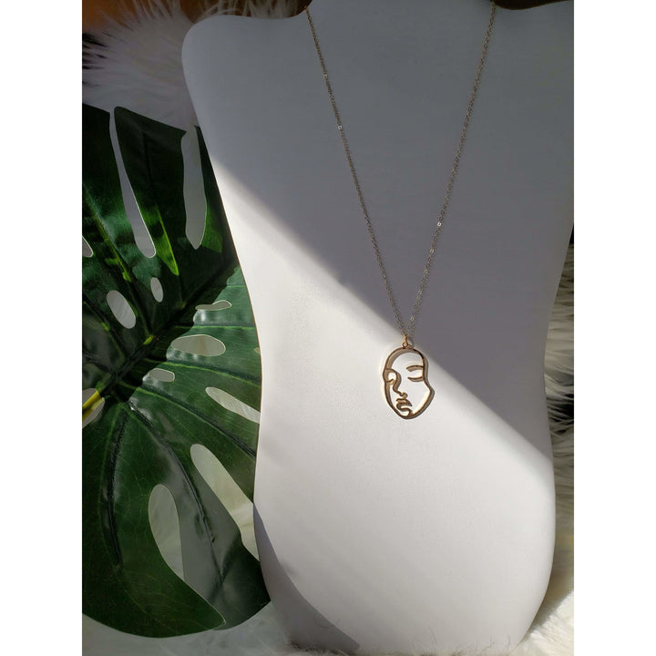 gold face necklace