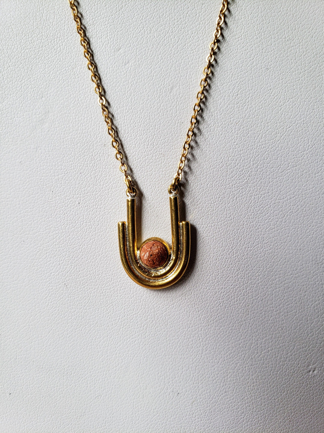 gold and clay necklace