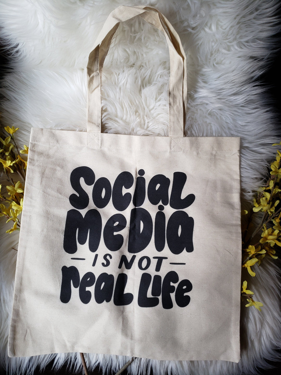 social media is not real life tote bag