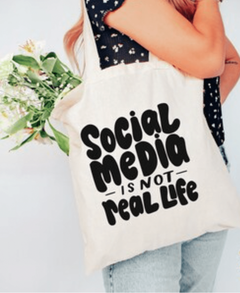 social media is not real life tote bag